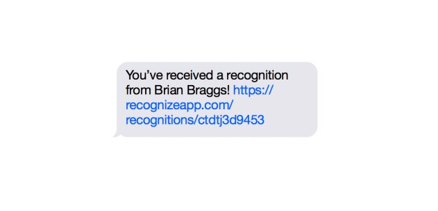 An employee receiving an SMS of employee recognition