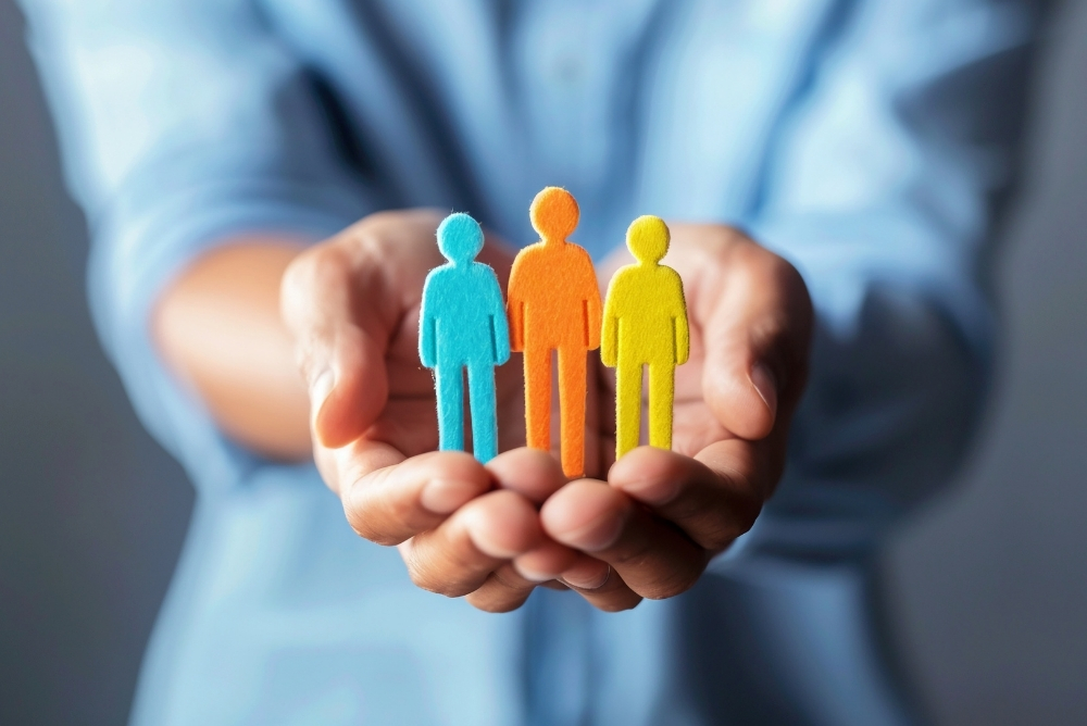 Employee recognition concept showing diverse team figures symbolizing engagement and inclusion in manufacturing workforce