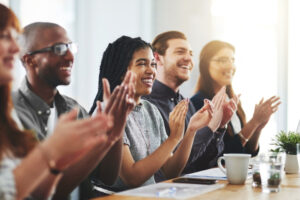 Team members engaging in workplace recognition and participation