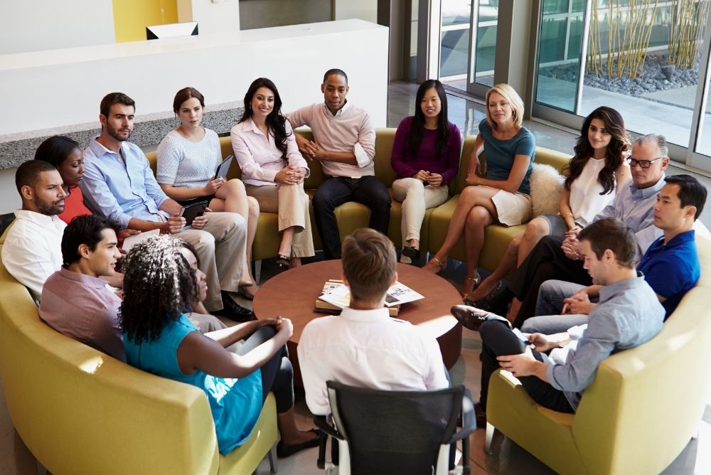Credit union employees meeting to build a strong workplace culture
