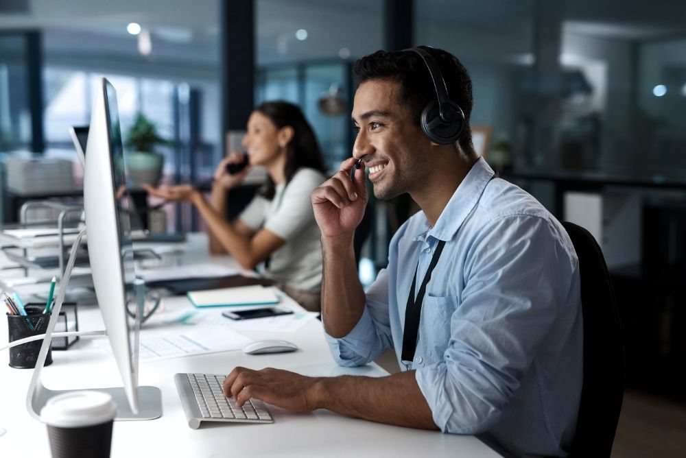 Sales team working with customers while tracking sales incentive program performance